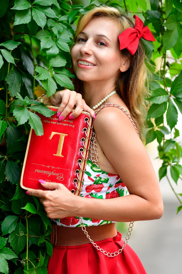 Woman Holding A Red Bag