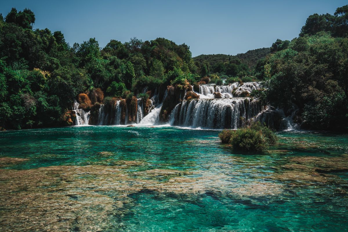 Turquoise waters and lush vegetation at Krka National Park in Croatia
