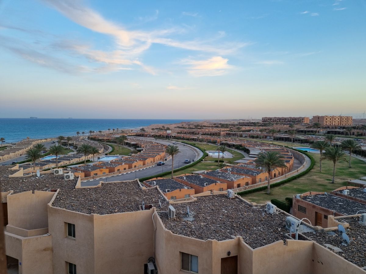 Aerial view of a coastal neighborhood with palm-lined streets near Hurghada, Egypt
