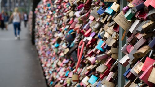 Free Vibrant padlocks attached to a bridge symbolizing love and commitment. Stock Photo