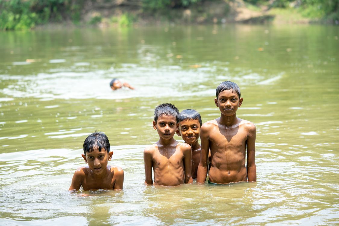 Boys Standing In The Water Free Stock Photo boys-standing-in-the-water-free-stock-photo