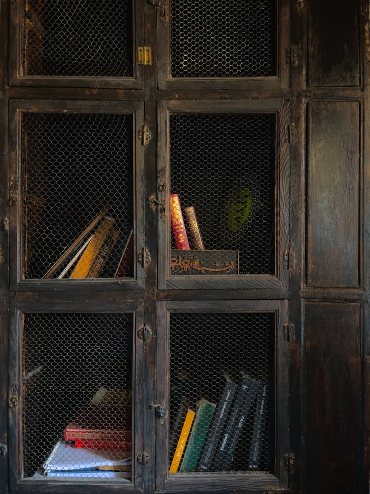 Brown Wooden Cabinet With Books