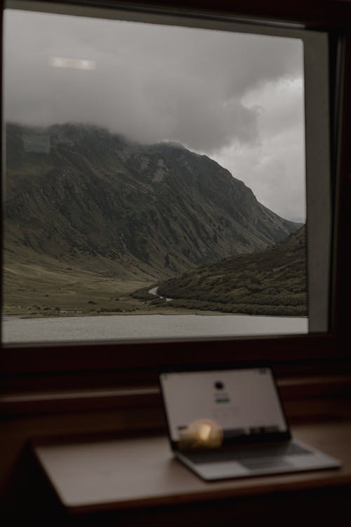 A Glass Window Overlooking a Mountain View