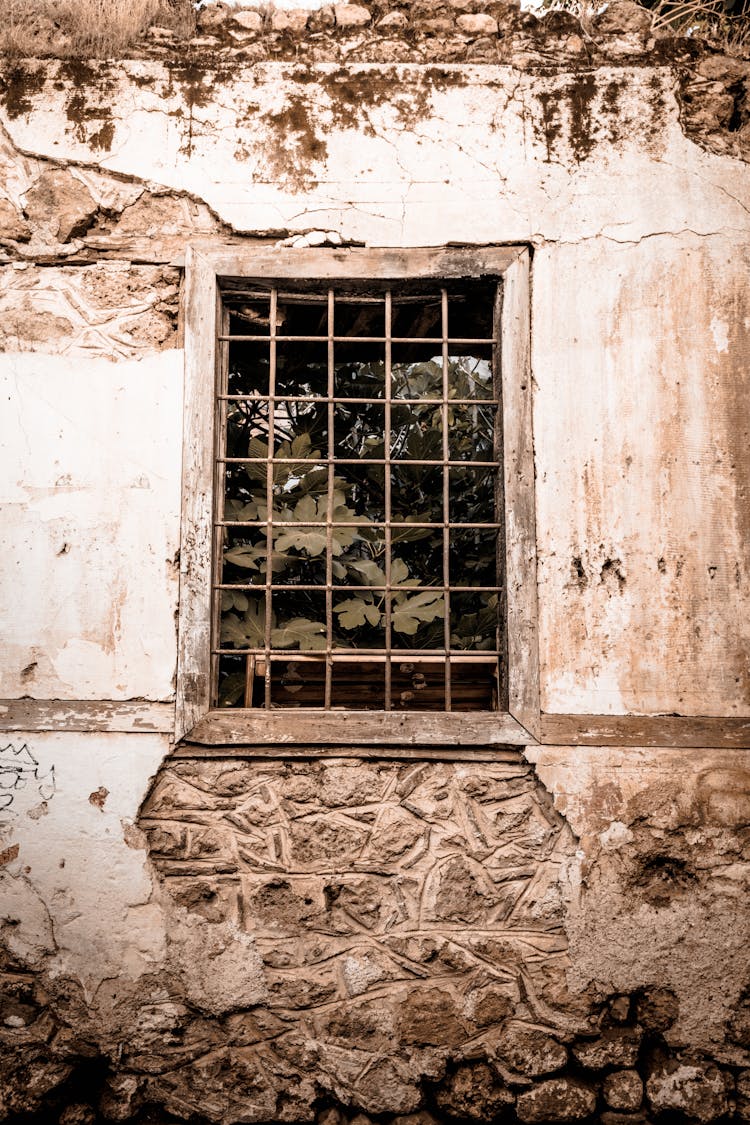 Abandoned House With Decayed Wall And Window