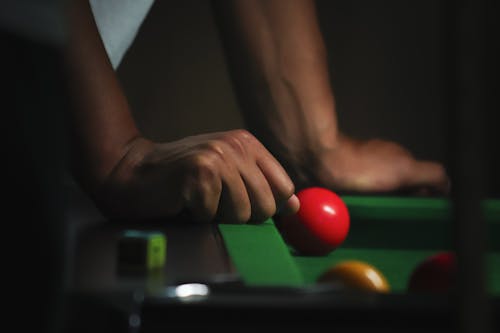 Close-up of Hands on Billiard Table