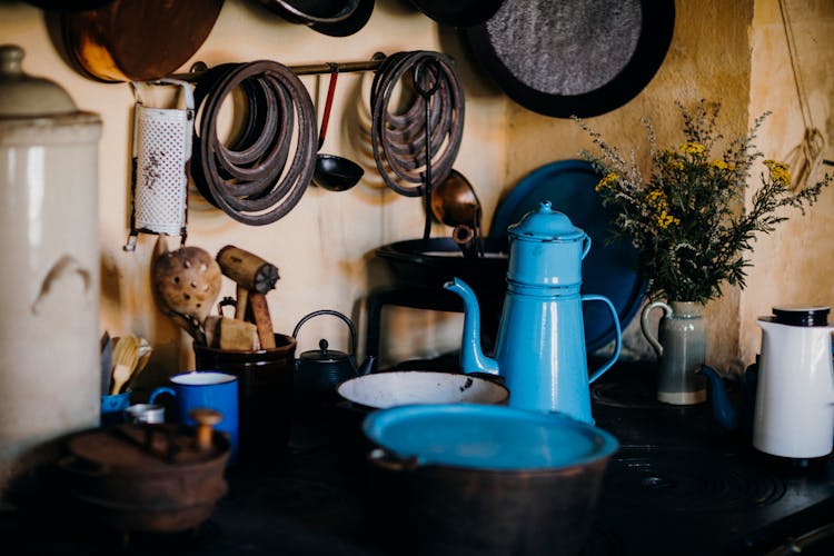 A Kettle And Pots In A Kitchen 