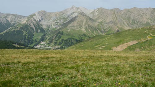 Green Grass Field Near Mountains