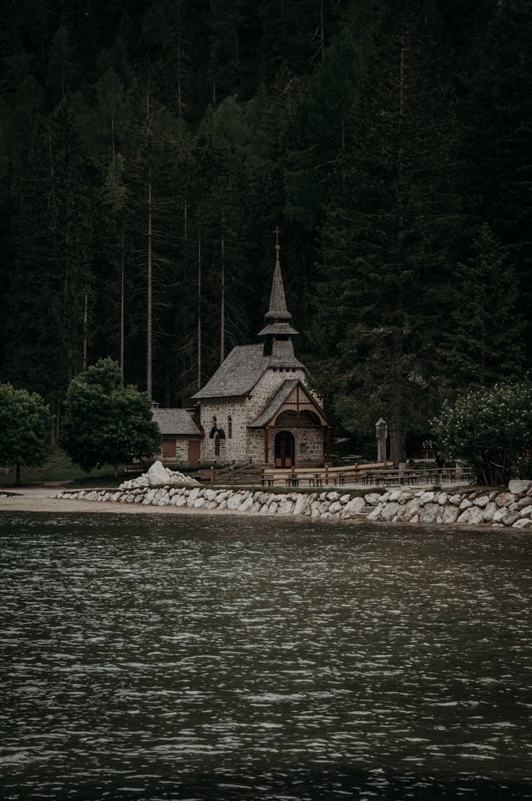 Ancient Building Near Water In Woods