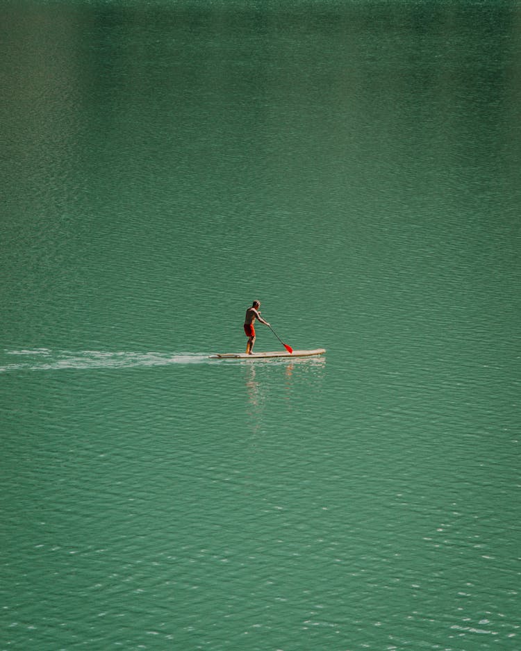 Man On Canoe In Water