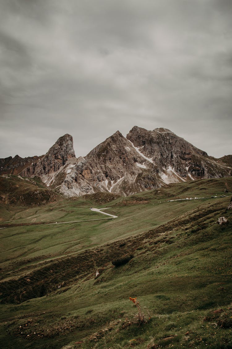 Green Hills Near Mountains In Nature Landscape