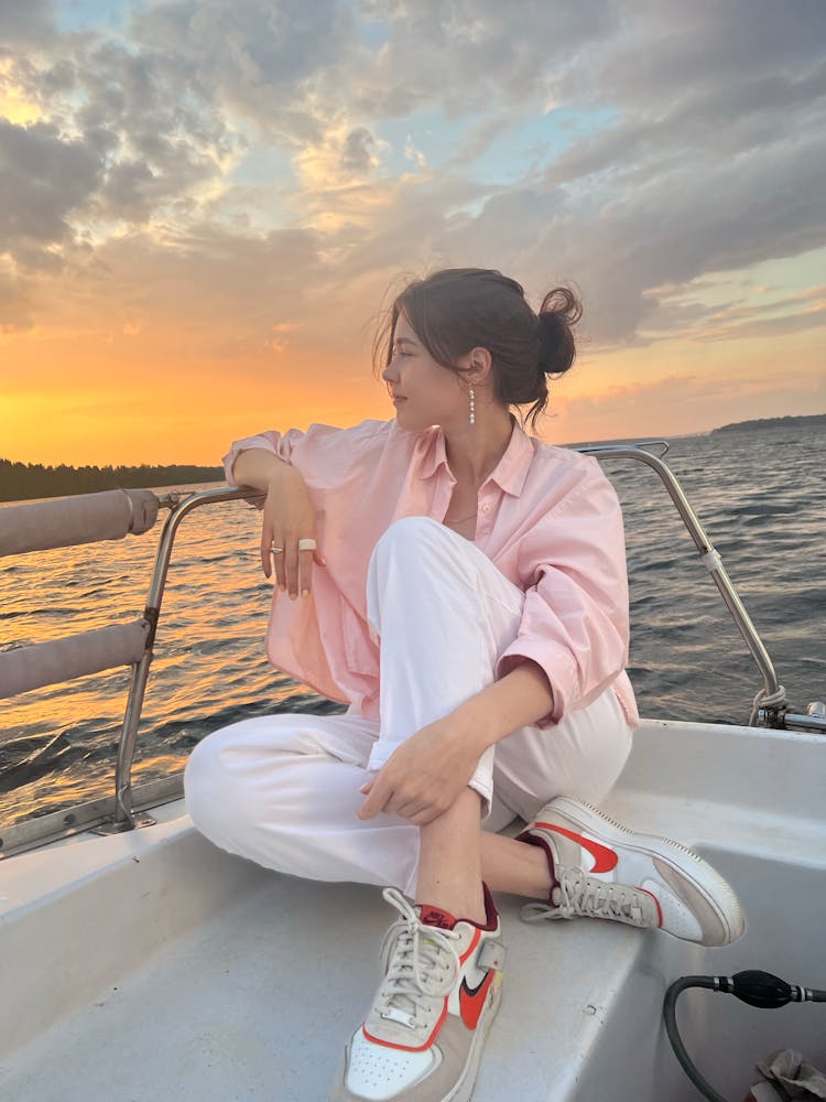 A Woman Sitting On The Boat 