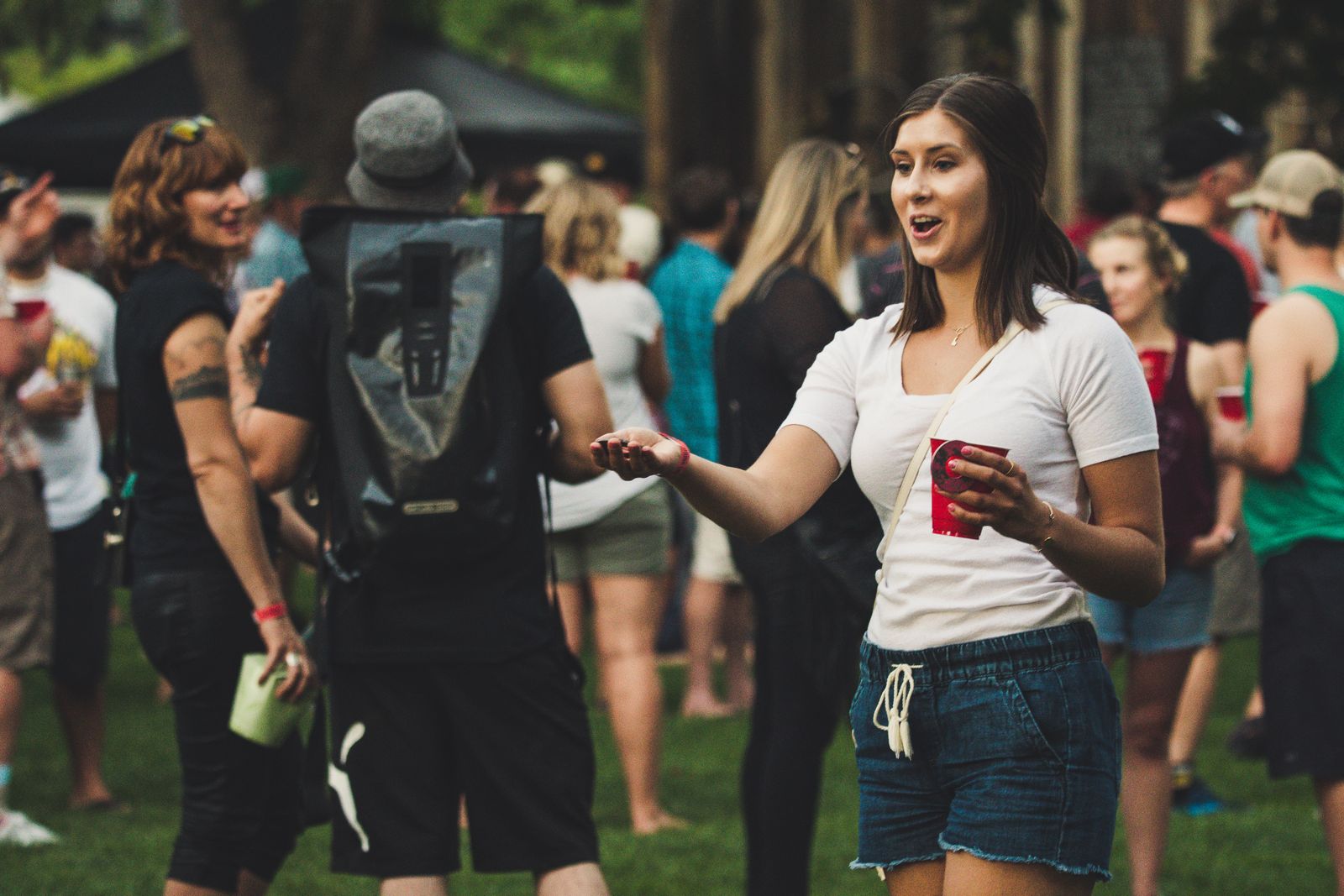Group of friends dancing together at an outdoor desert music festival