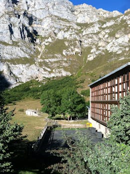 Explore the serene mountain scenery and rustic architecture in Northern Spain.