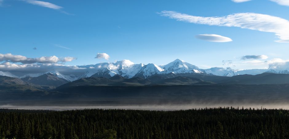 Breathtaking Grizzly Falls Ziplining Expedition Review: Alaska's Most Thrilling Rainforest Adventure Review 2026 - Stunning panoramic view of snow-capped mountains in Alaska's wilderness during summer.