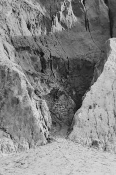 Black and white depiction of striking rock formations in Canoa Quebrada, Brazil.
