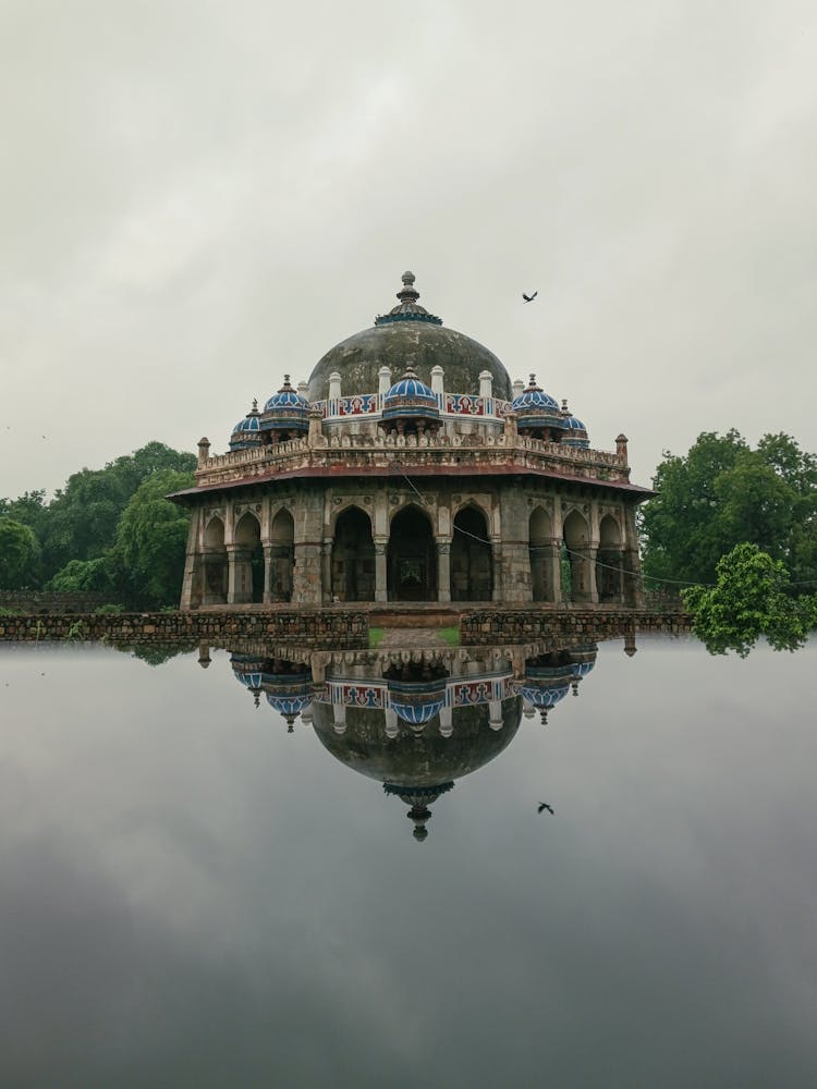 Tomb Of Isa Khan Reflecting In A Lake, Delhi, India