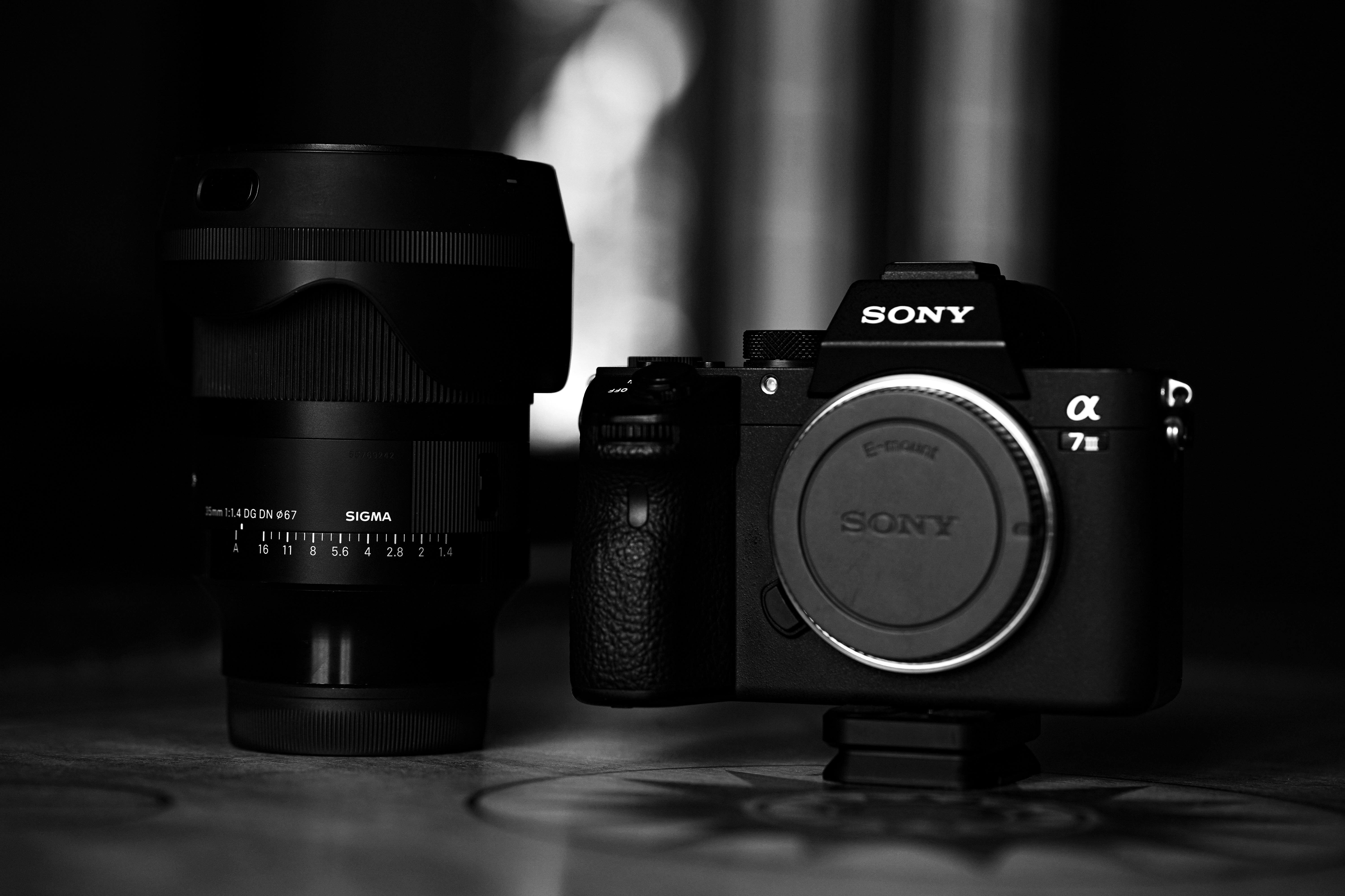 Grayscale Photo of Camera Lens and Camera · Free Stock Photo