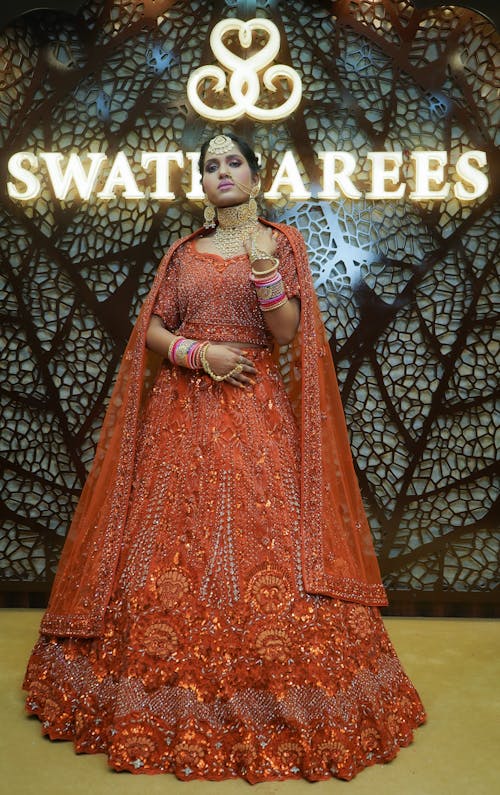 Woman in Traditional Clothing and Jewelries