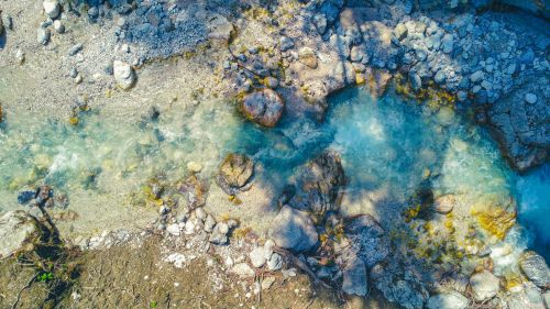 Free A stunning aerial shot of a crystal-clear stream flowing through rocks in Germany. Stock Photo
