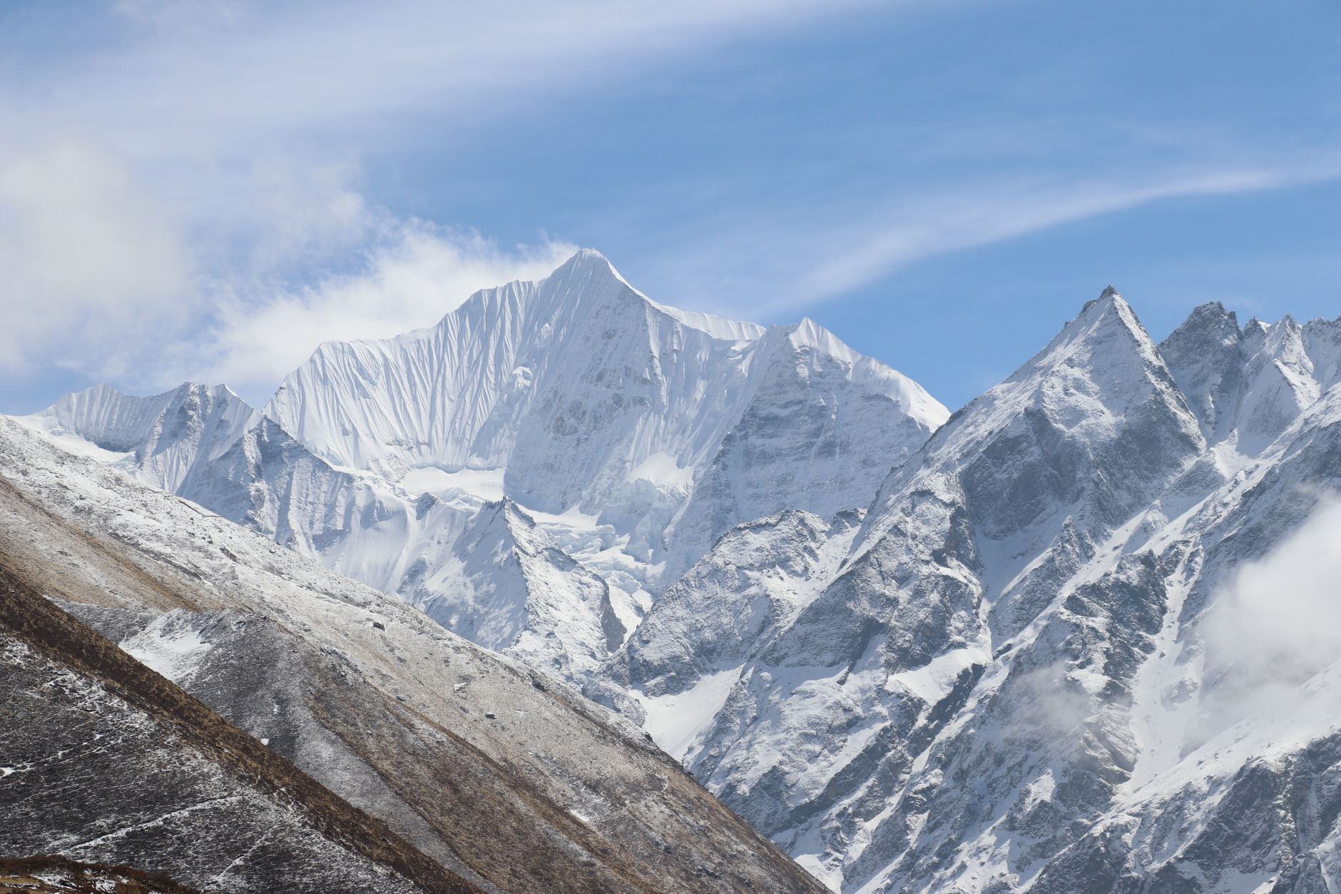 Majestic snow-covered Langtang mountains under a clear blue sky in Nepal