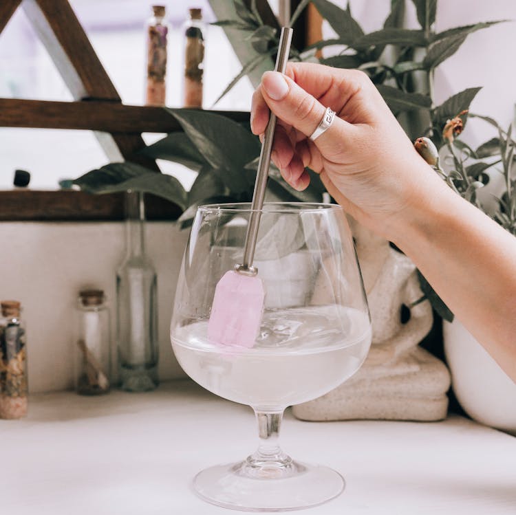 Person Stirring A Cocktail 