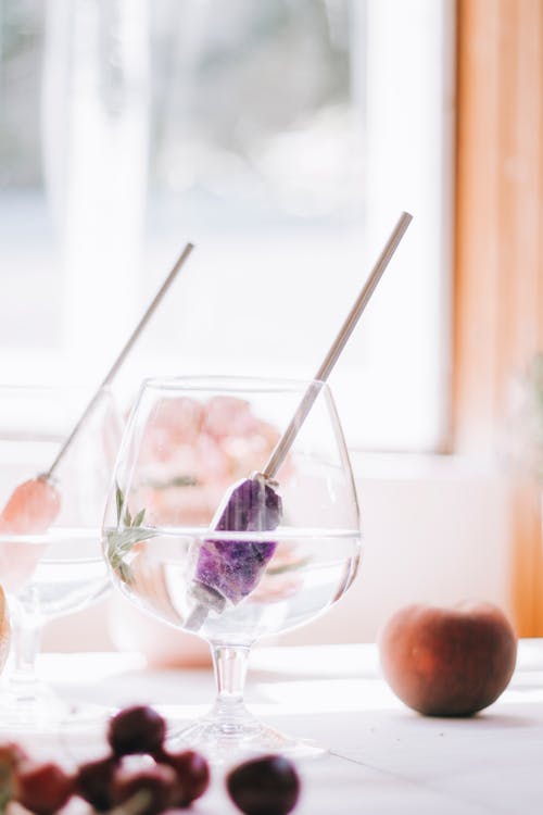 Glass with Metal Straw on Table