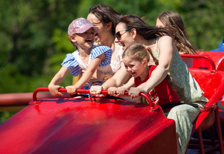 Mothers And Daughters In An Amusement Ride