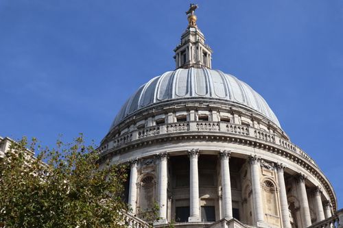Free Magnificent view of the iconic dome of St. Paul's Cathedral set against a clear blue sky in London. Stock Photo