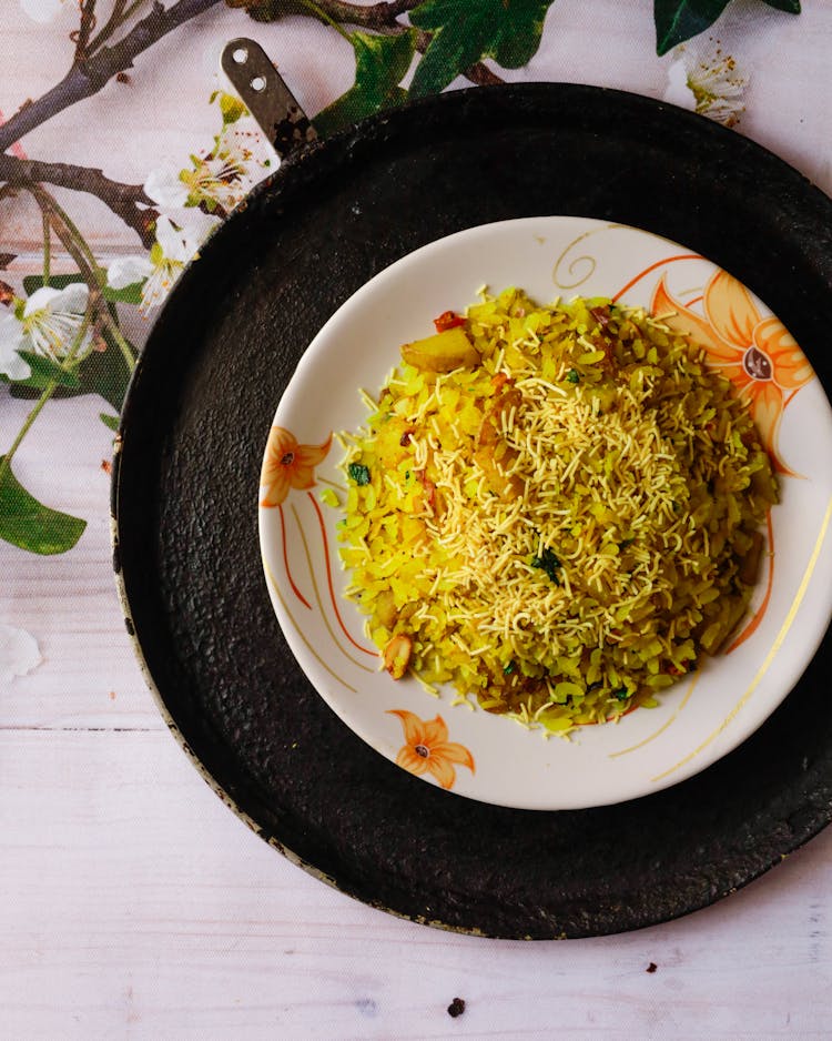 Indian Breakfast Dish Poha On White Wooden Background Photo