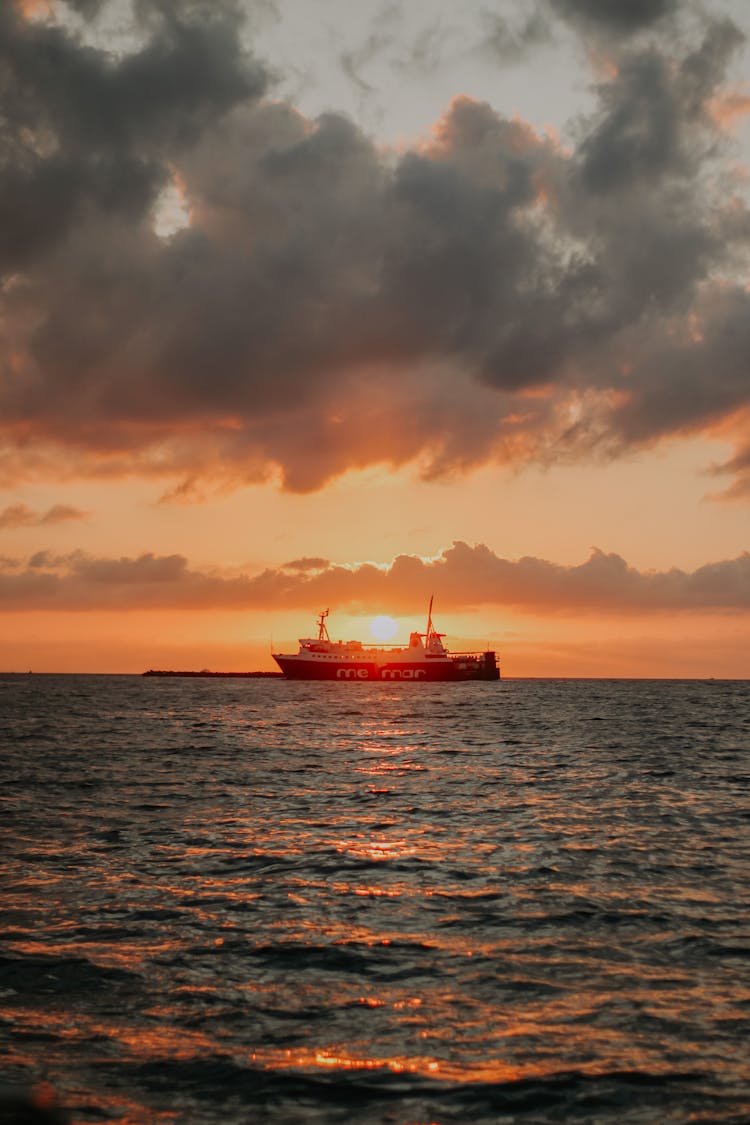 Ship In Water On Sunset