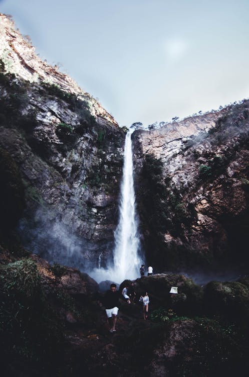 People on Brown Rock Near  Waterfall  Free Stock Photo People on Brown Rock Near  Waterfall  Free Stock Photo