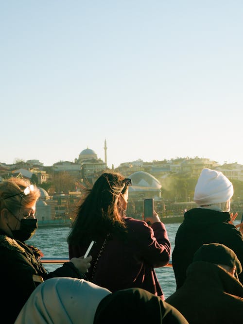 Travelers Standing on Ferry Passing Bosporus Strait