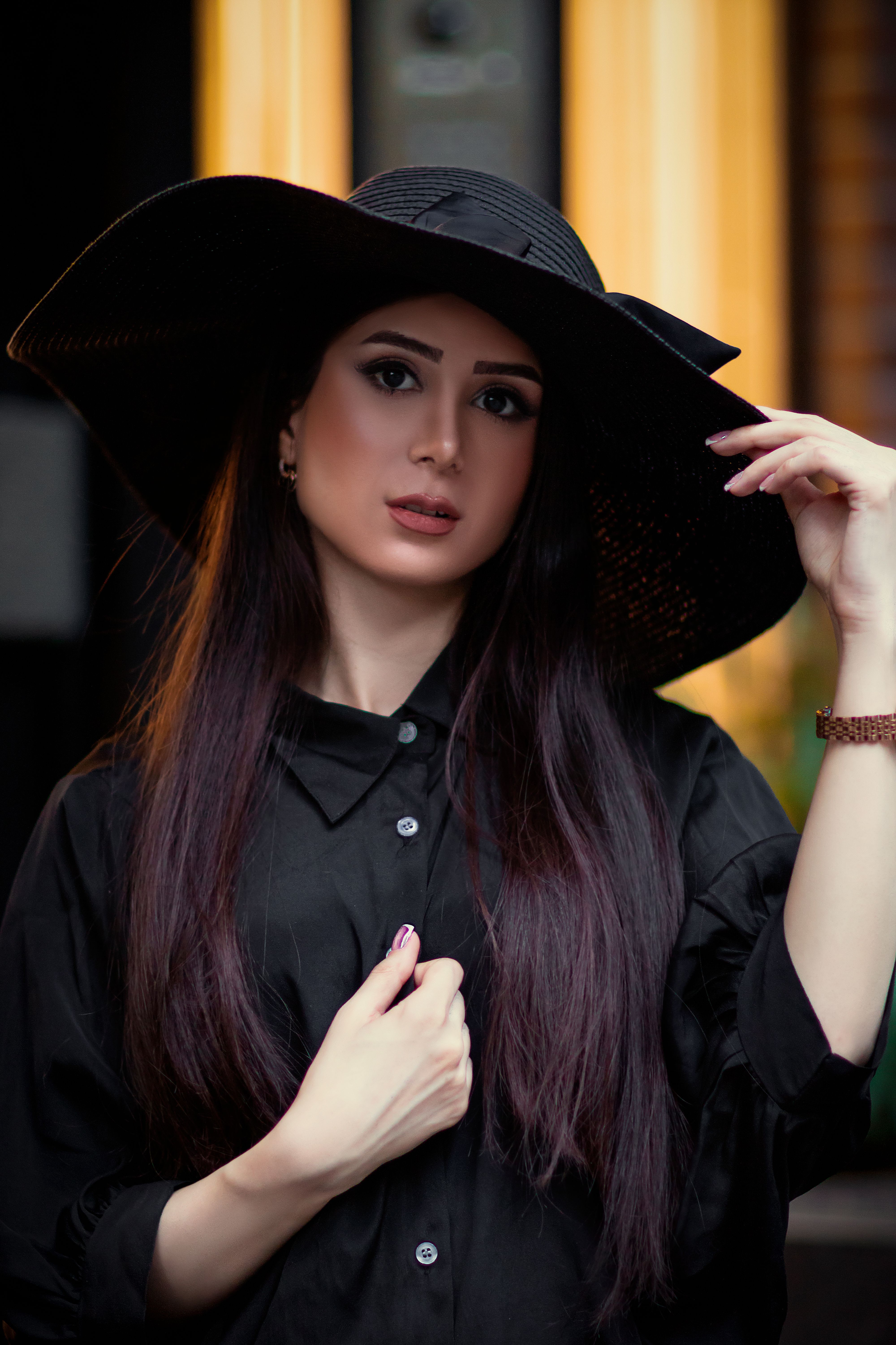 Close-Up Shot of a Beautiful Woman Wearing Black Hat · Free Stock Photo