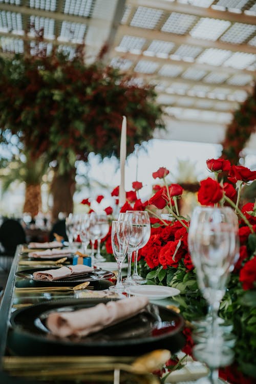 A Table Setup with Red Roses