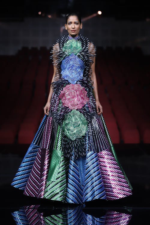 Model Standing on Multi Colored Dress