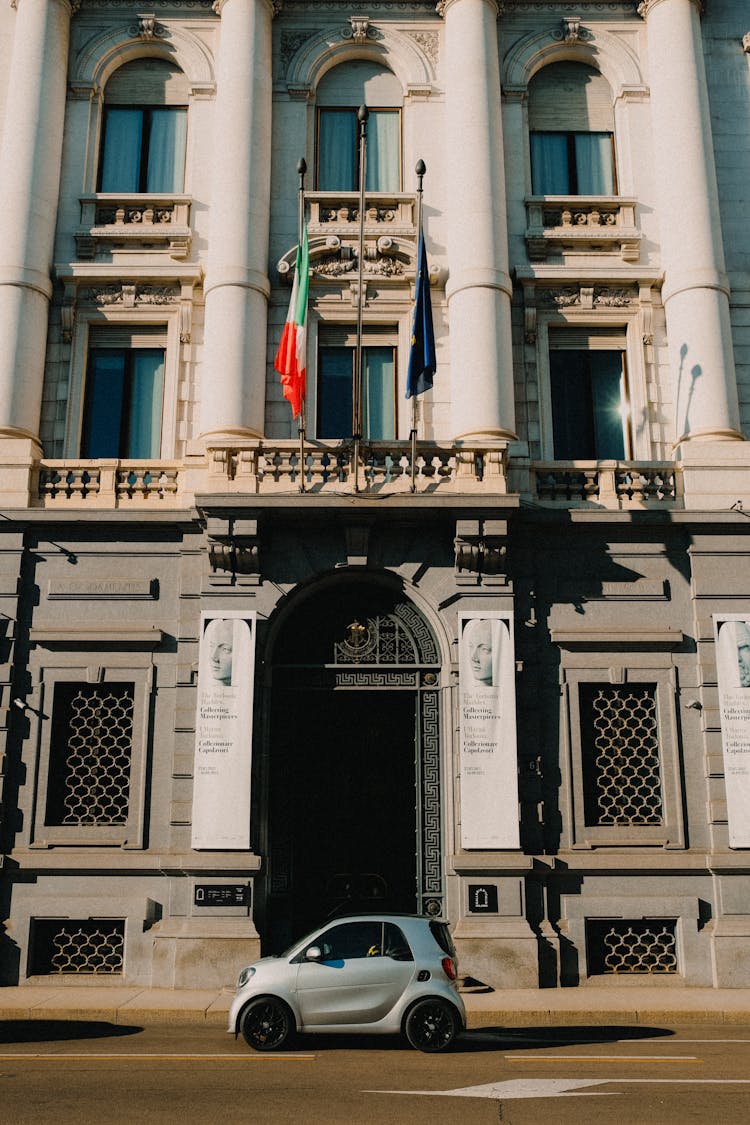 Car Parked In Front Of A Government Building