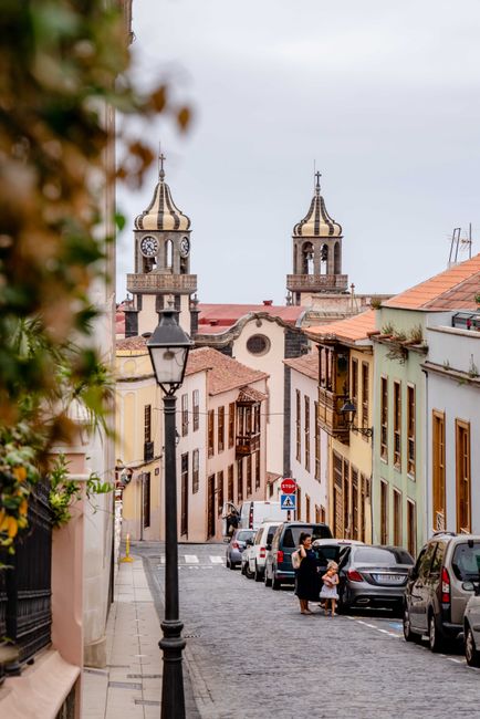 Picturesque street in La Orotava with historic architecture and bell towers, perfect for travel enthusiasts.