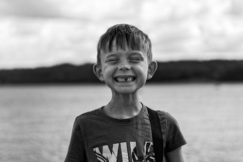 Free Boy at Lake Smiling Stock Photo