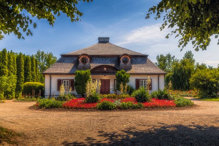 Country cottage edged with bright summer borders