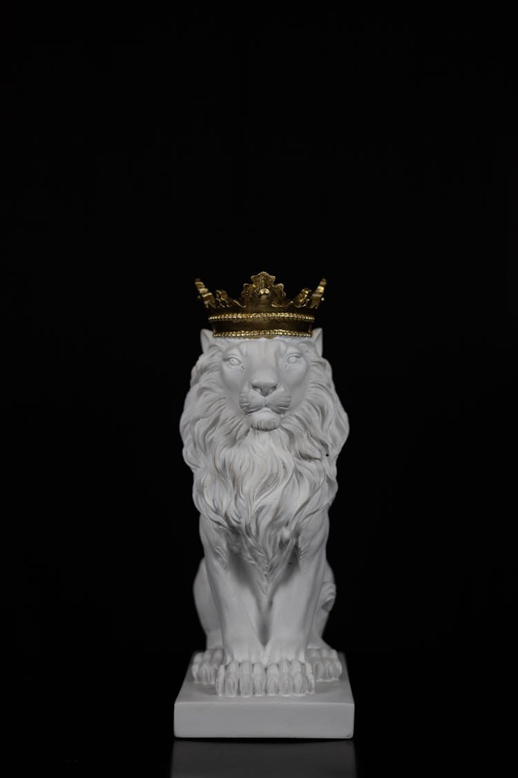 A Sculpture Of A Lion With A Crown