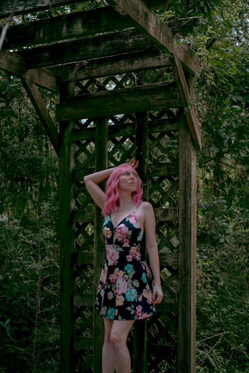 Free A Woman Wearing a Floral Dress with Pink Hair Stock Photo