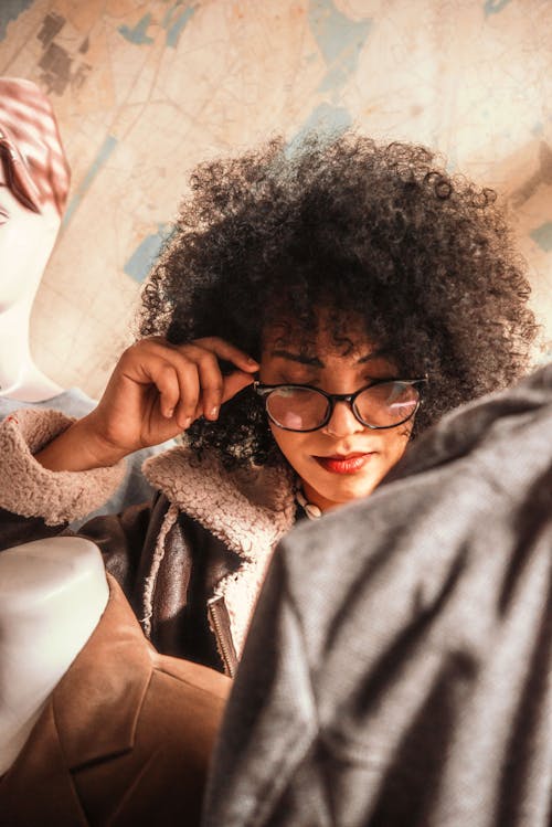 Woman with Afro Hair Wearing Eyeglasses
