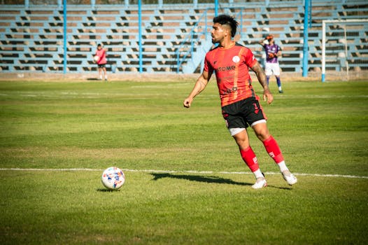 Dynamic action shot of a soccer player on the field in Mendoza, Argentina.