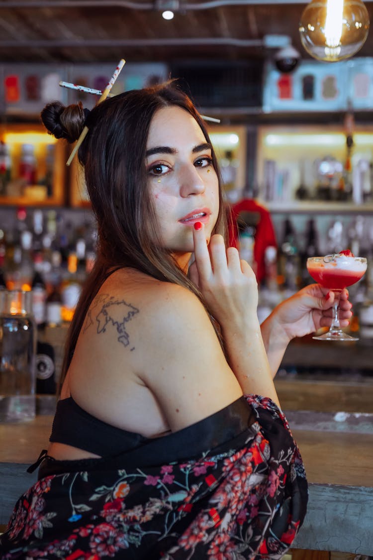 Woman With Cocktail Posing In Bar