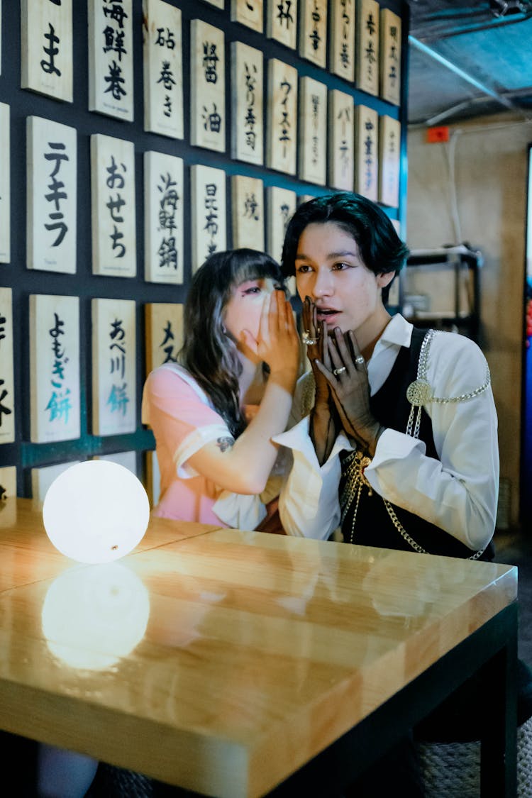 Woman Talking Near The Person's Ear 