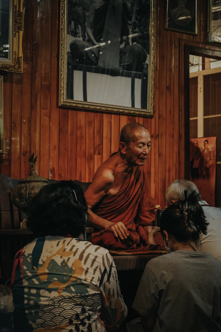 People Kneeling On The Monk 