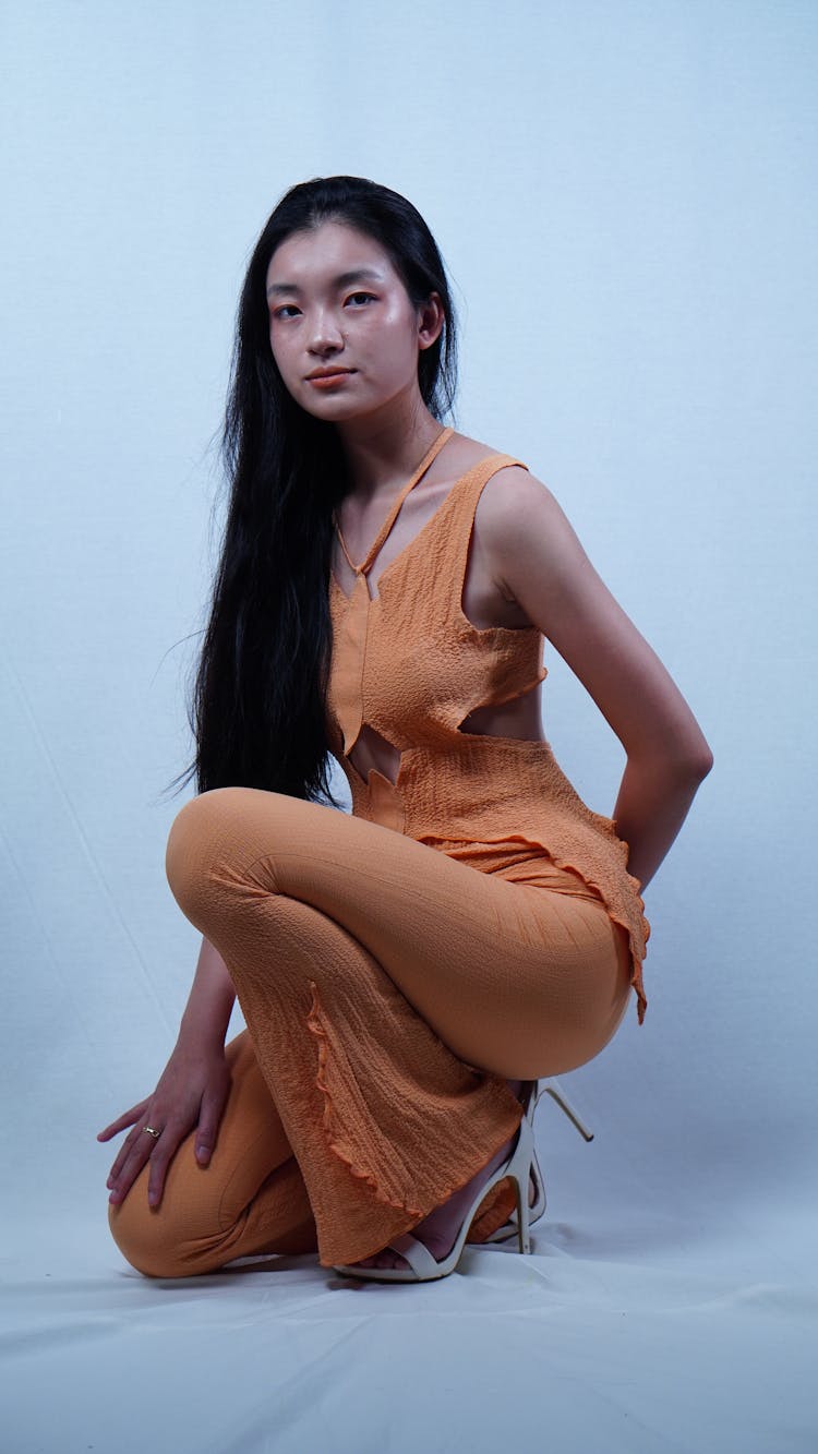 A Woman Wearing An Orange Jumpsuit