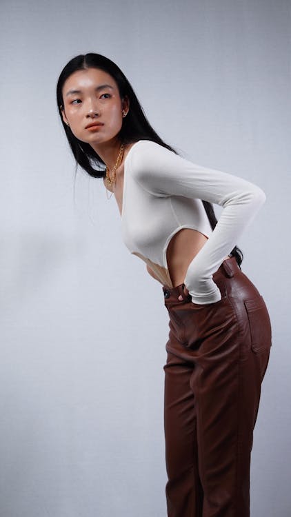 A Woman Wearing Brown Leather Pants · Free Stock Photo