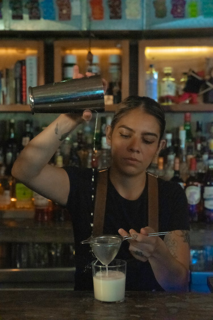 A Woman Making A Drink