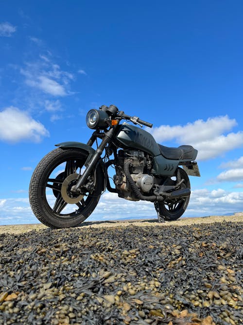 Free stock photo of classic motorcycle, sand and beach, sea front Stock Photo